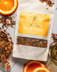 Nurture herbal tea. Organic herbal tea. Coffee replacement, caffeine-free. Dandelion root, dried orange peel, lemon balm, rosemary. Tea for digestion. Tea for energy.